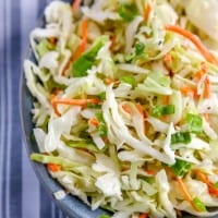 homemade coleslaw with blue striped napkin