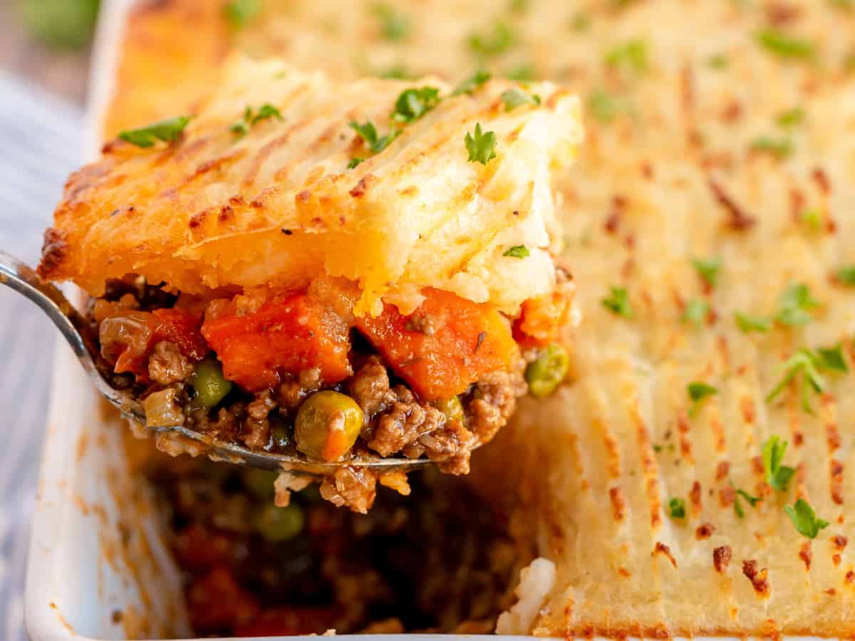 shepherd's pie being scooped out with a spoon