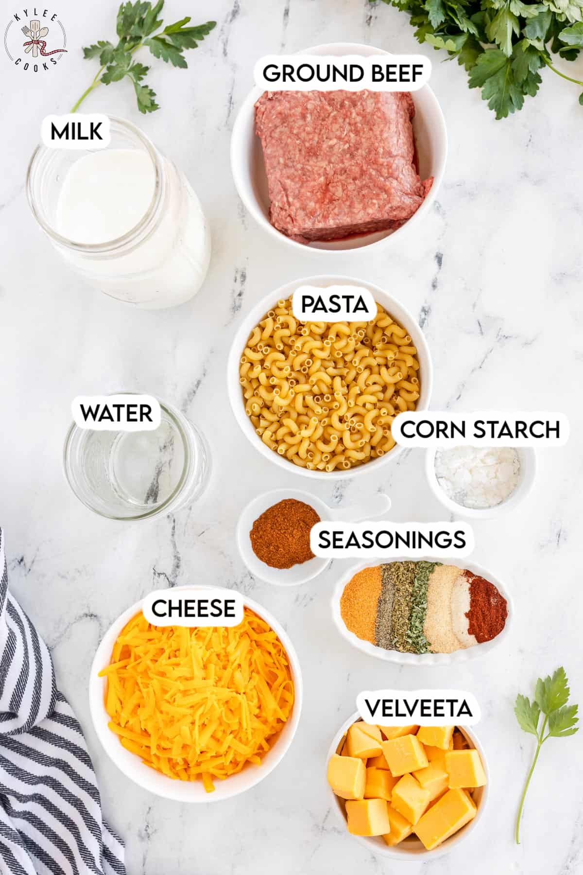 ingredients to make cheeseburger macaroni laid out and labeled.