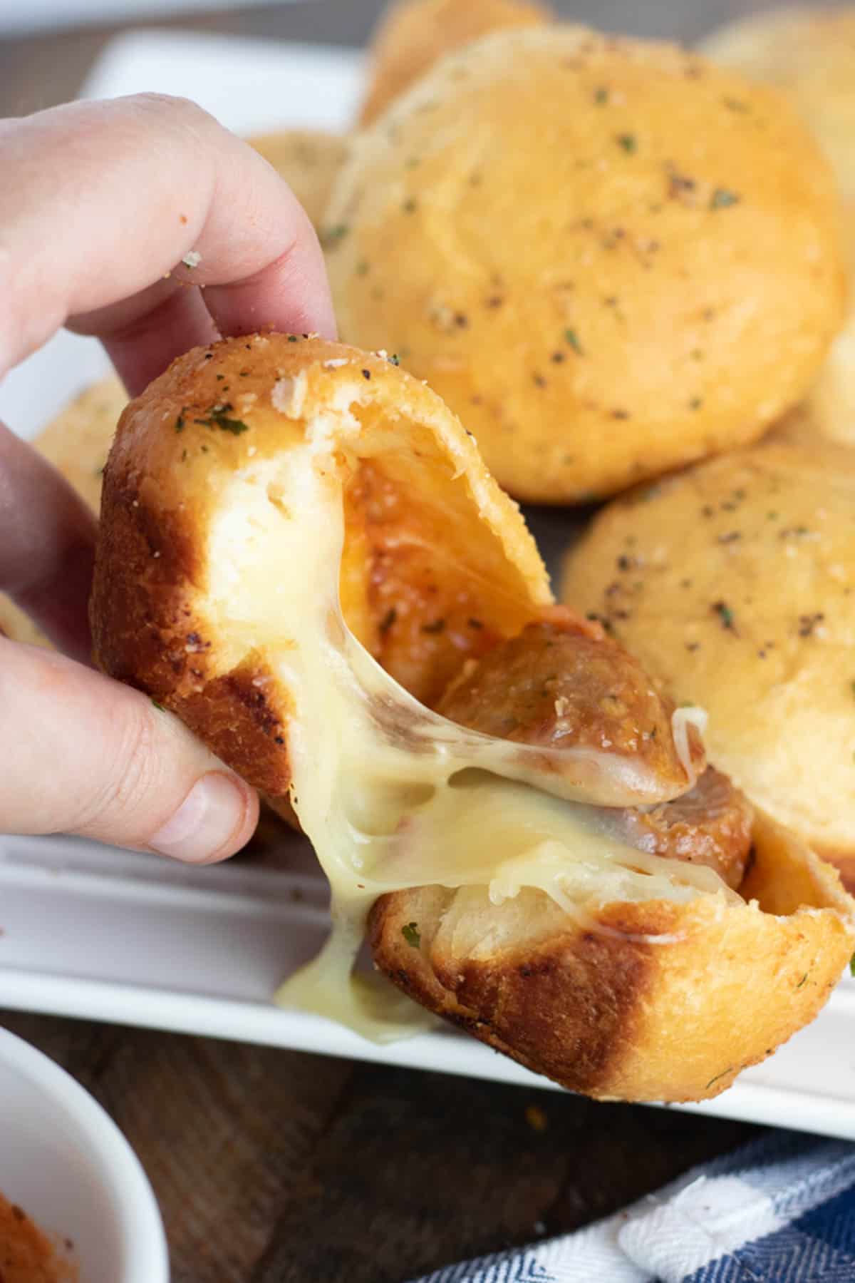 meatball bombs cut open to show cheese. 
