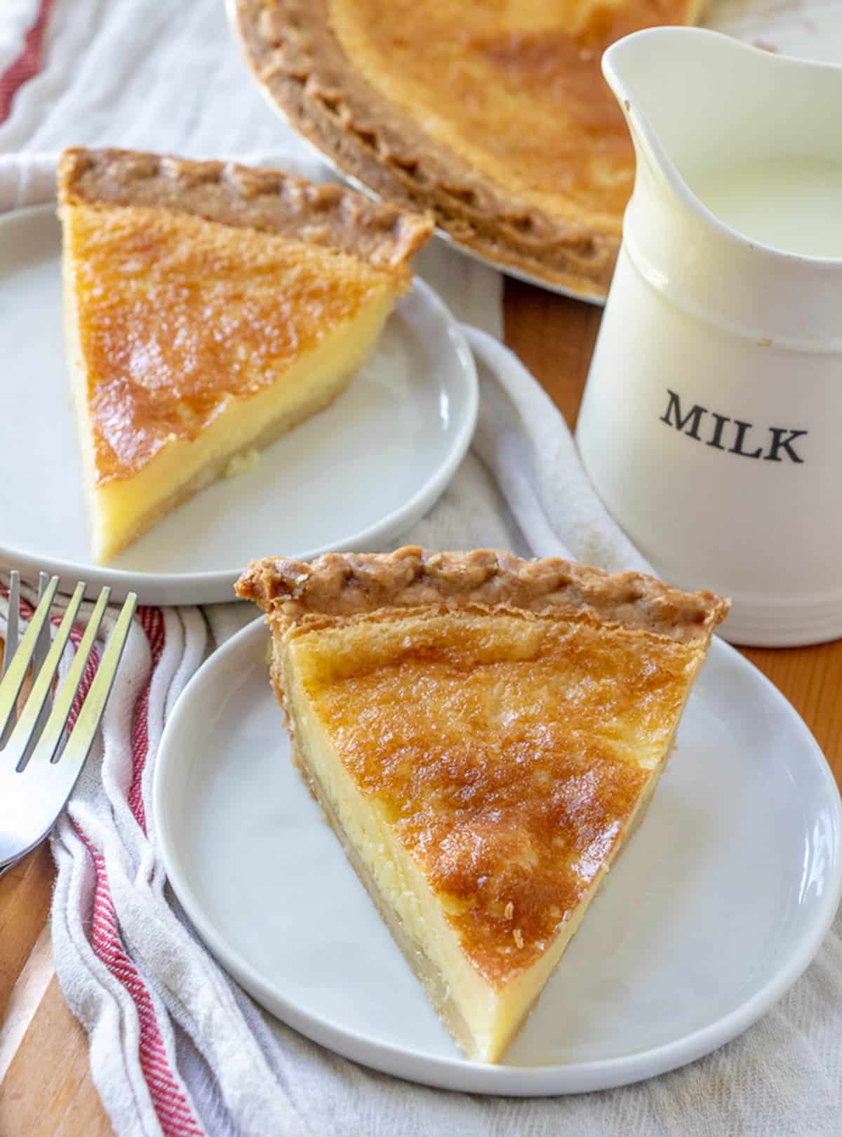 Buttermilk pie on a plate with a white and red napkin