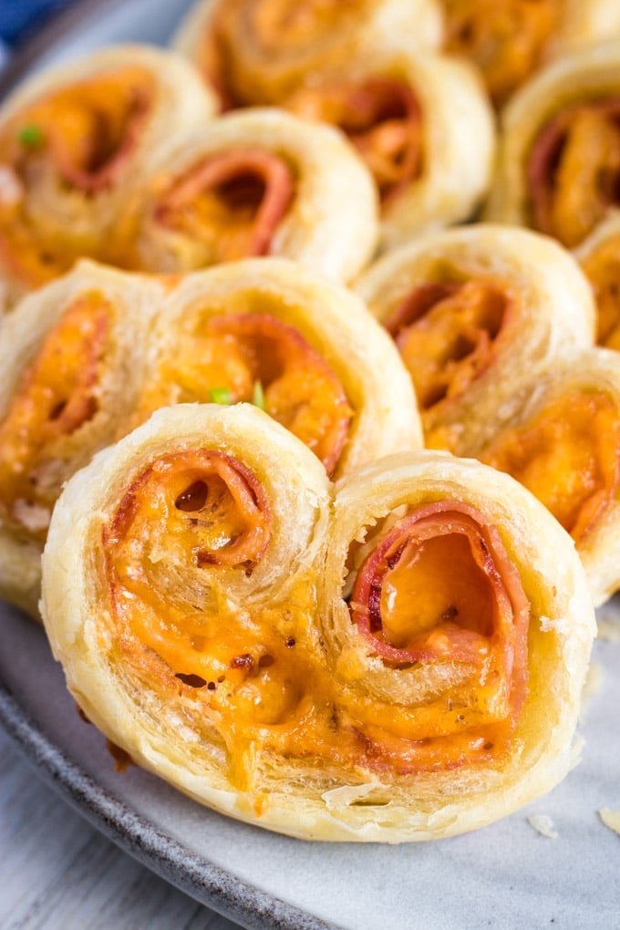 savory ham and cheese palmiers on a platter