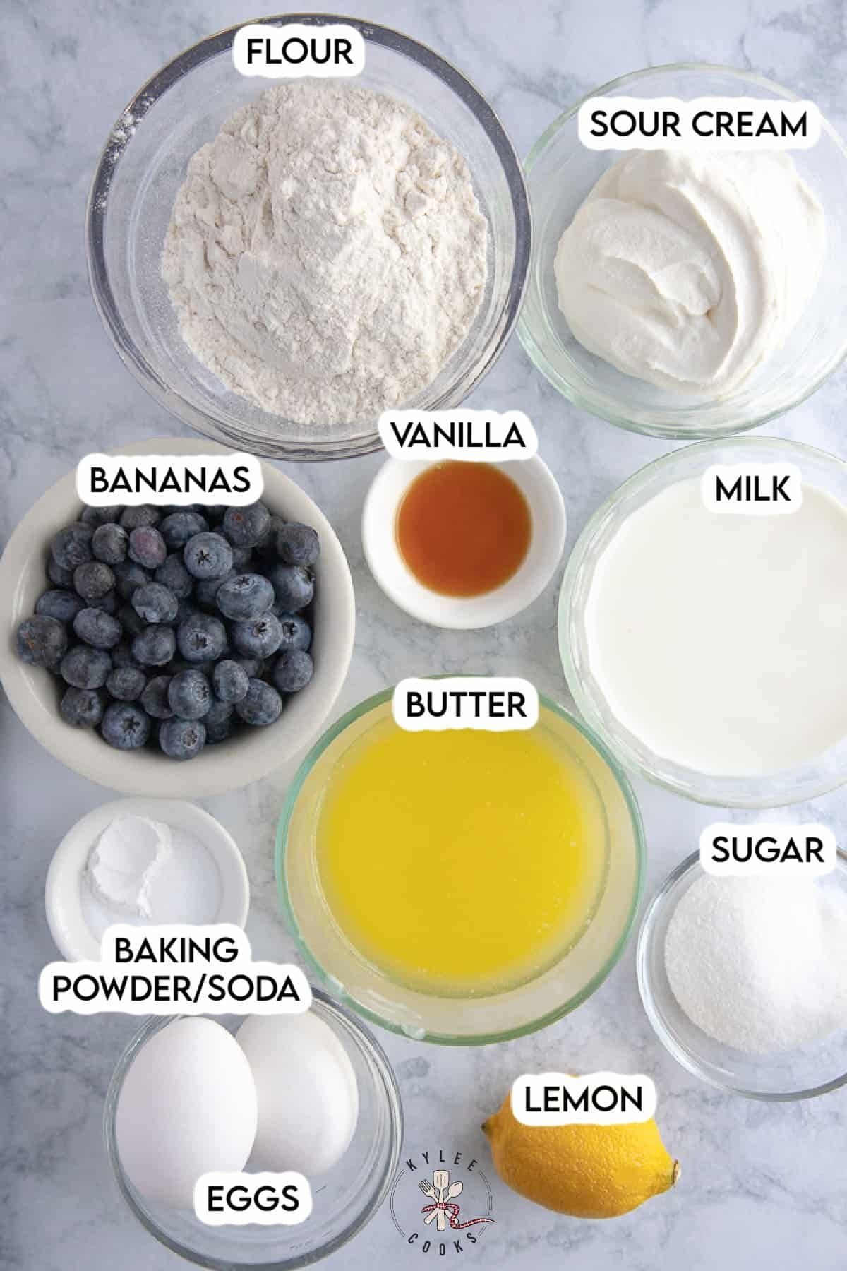 ingredients to make blueberry pancakes laid out and labeled.