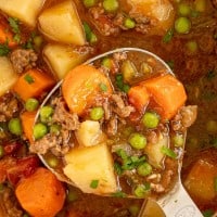 ground beef stew on a ladle.