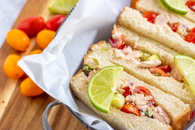 tuna salad in a sandwich with lime