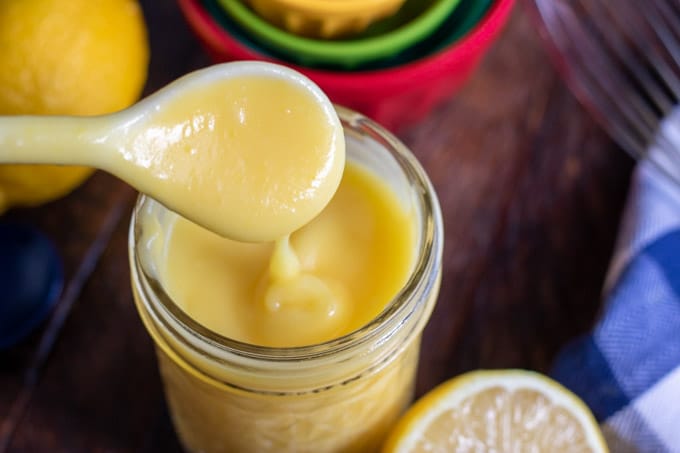 lemon curd in a jar with a spoon