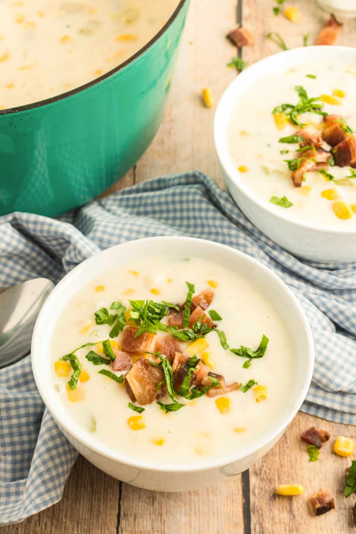 corn chowder in a bowl with a dutch oven