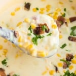 square image of corn chowder on a ladle
