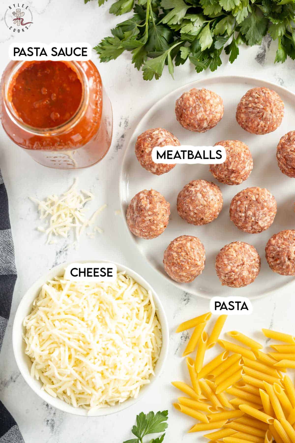 ingredients to make meatball casserole laid out and labeled.