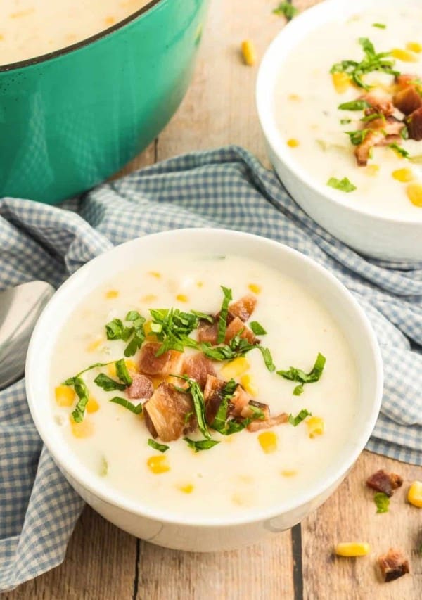 corn chowder in a bowl with a dutch oven