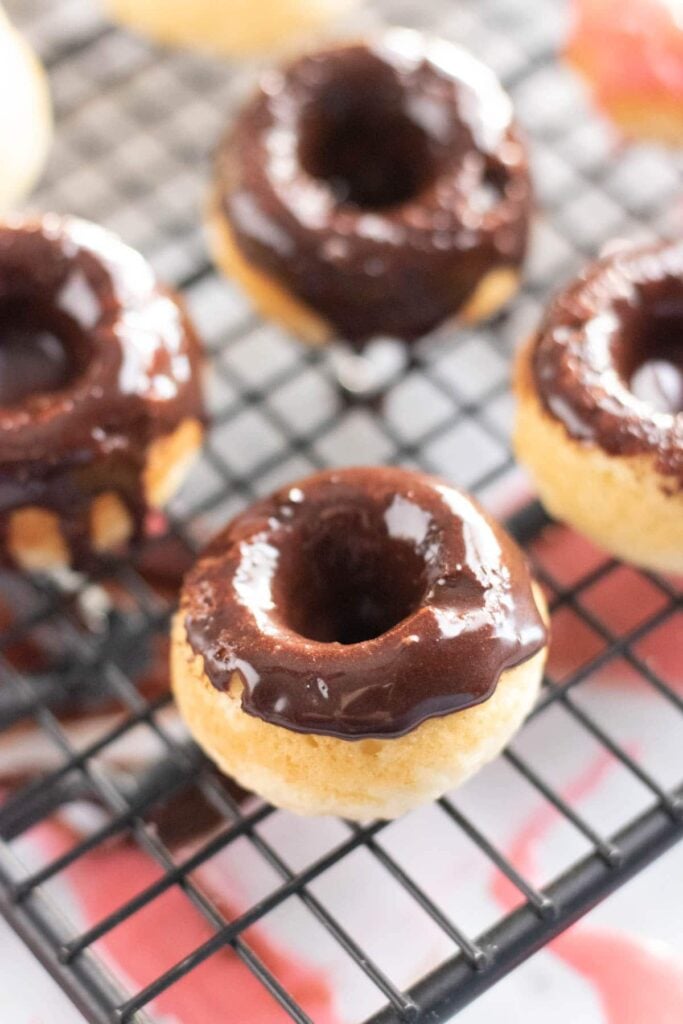 chocolate donuts on a rack