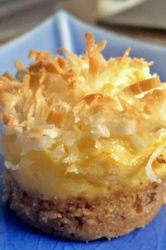 Coconut Pineapple Cheesecake on a blue plate