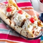 banana split on a brightly colored napkin with spoons