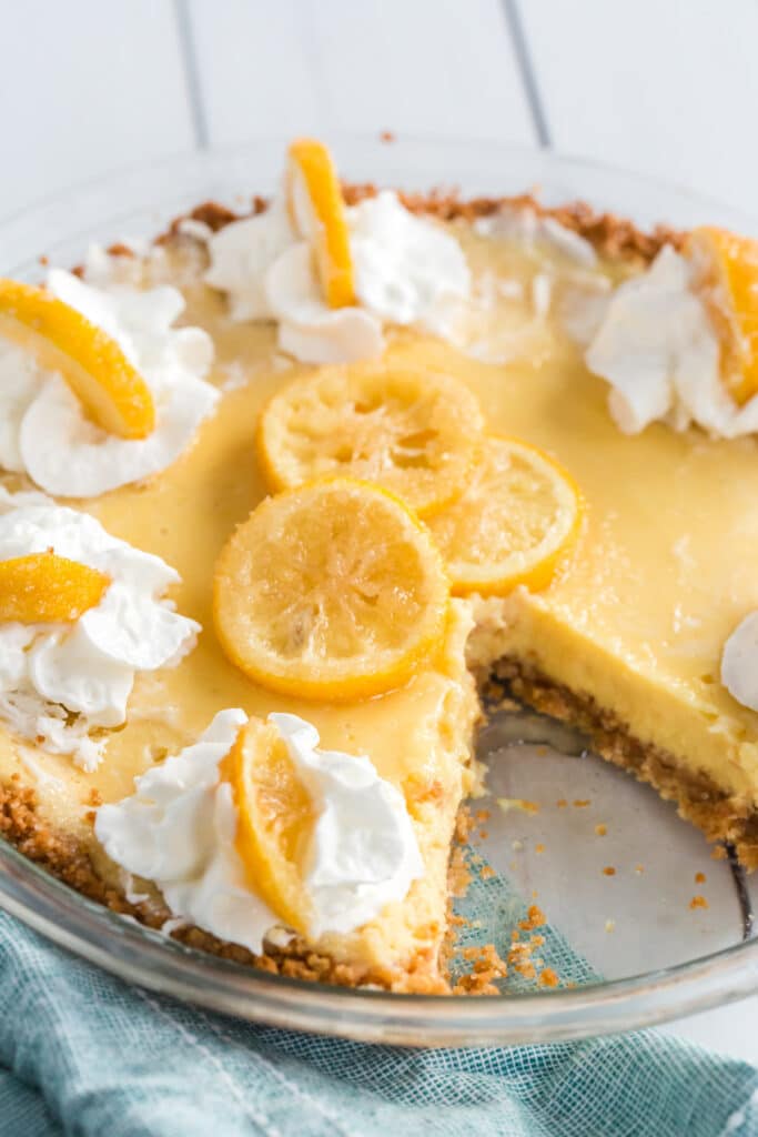 Lemon pie with a slice removed.
