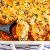 square image of sausage stuffed shells in a white casserole