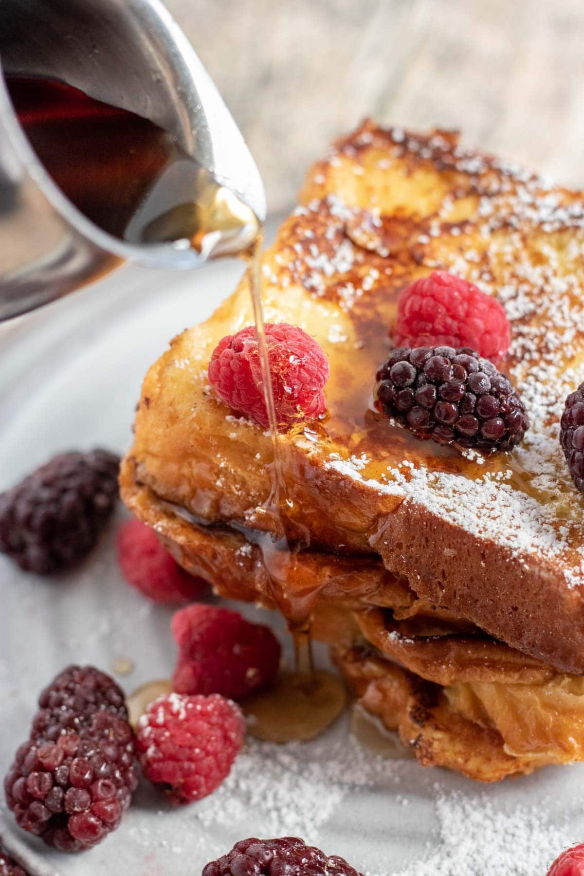french toast with berries and maple syrup