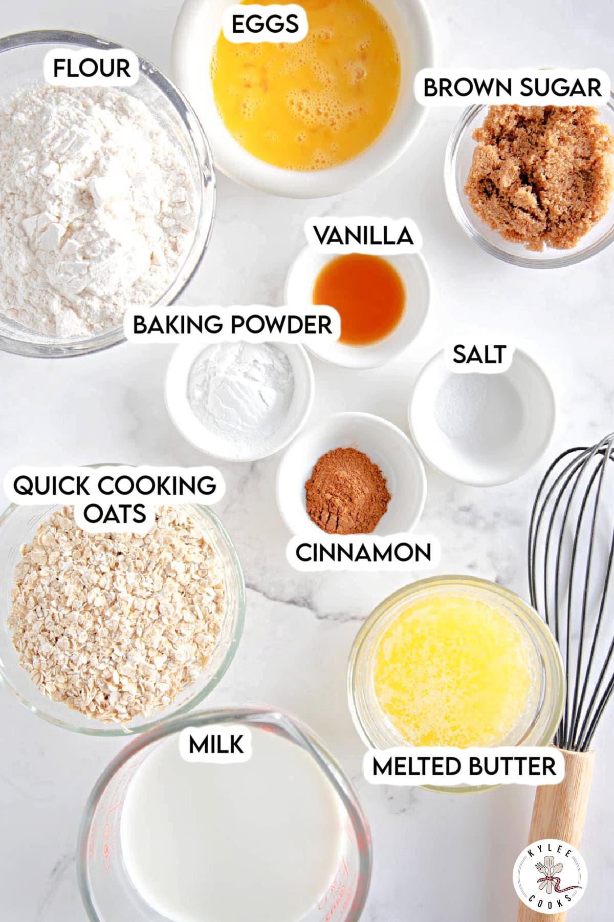 Various baking ingredients for oatmeal waffles, including flour, eggs, brown sugar, quick cooking oats, milk, melted butter, cinnamon, vanilla, baking powder, and salt, are arranged on a white surface.