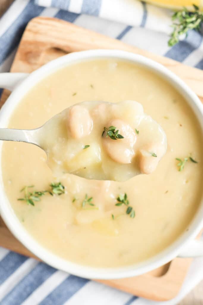 white bean potato soup on a spoon