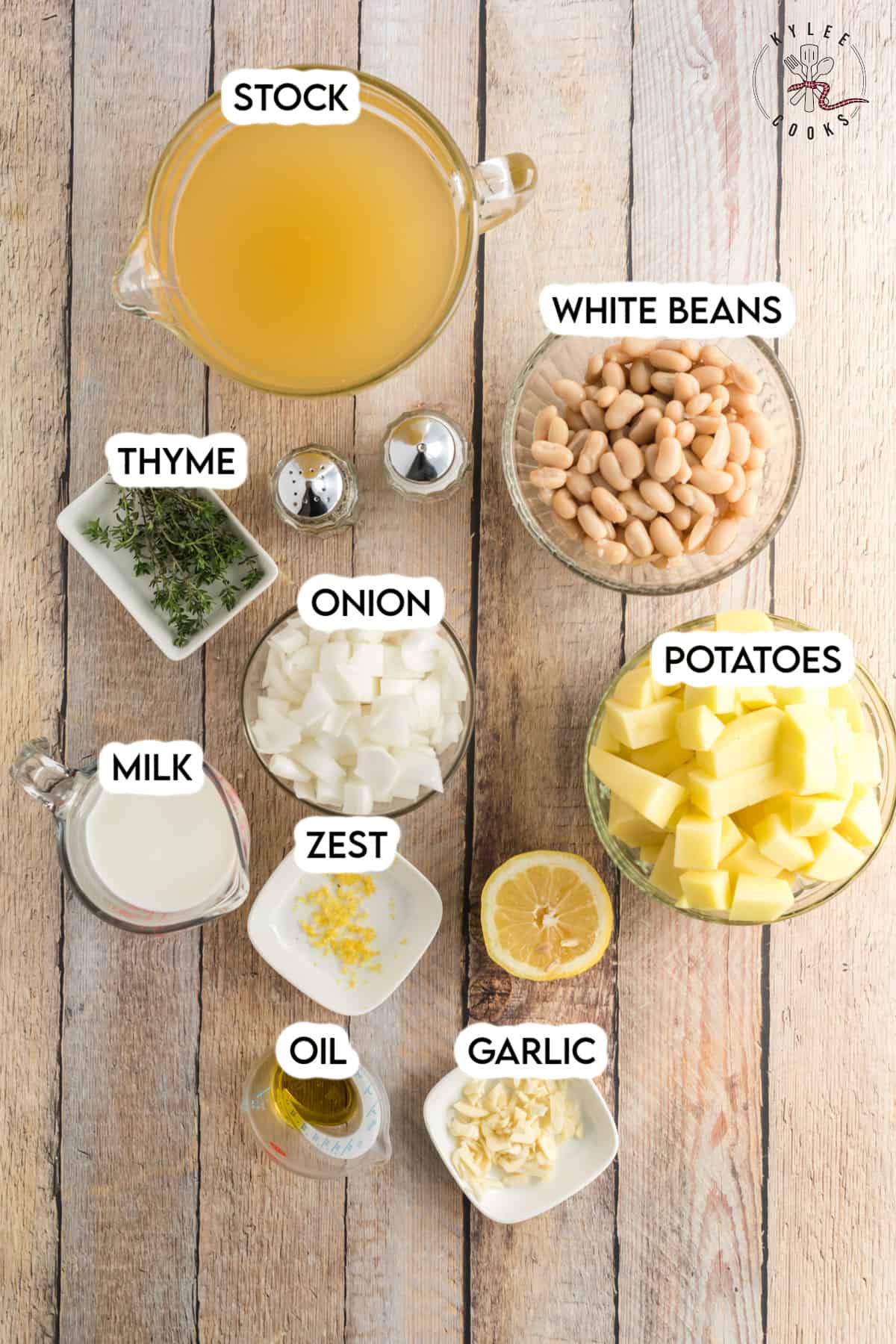 ingredients to make white bean soup laid out and labeled