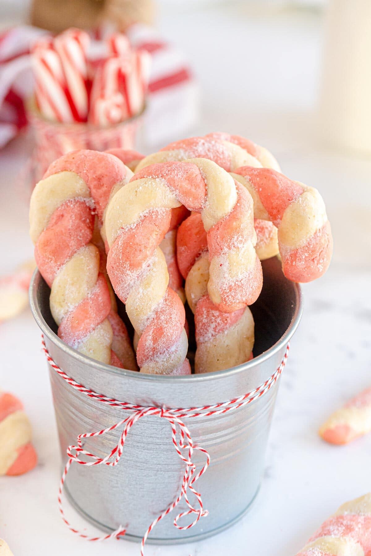 candy cane cookies in a round tin