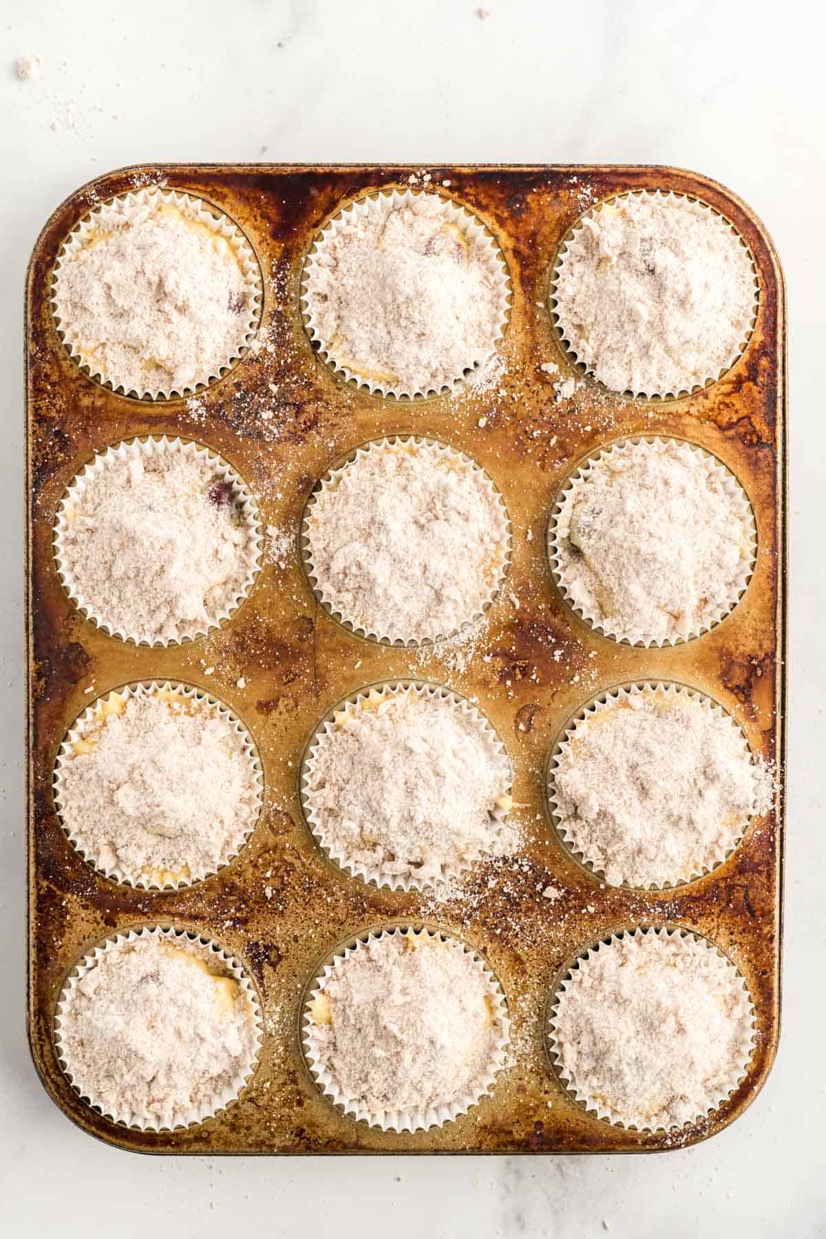 unbaked muffins in a muffin pan.