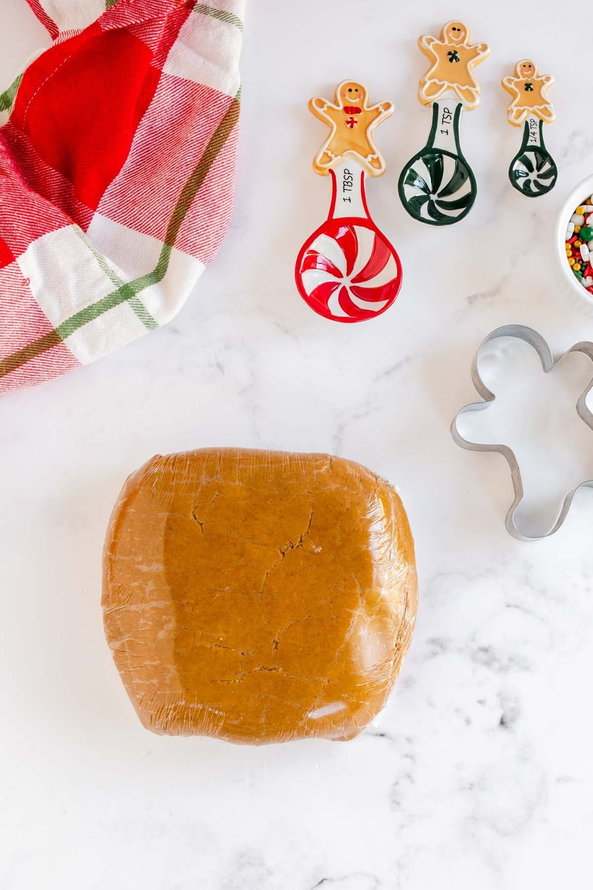 gingerbread dough wrapped in plastic, ready to chill
