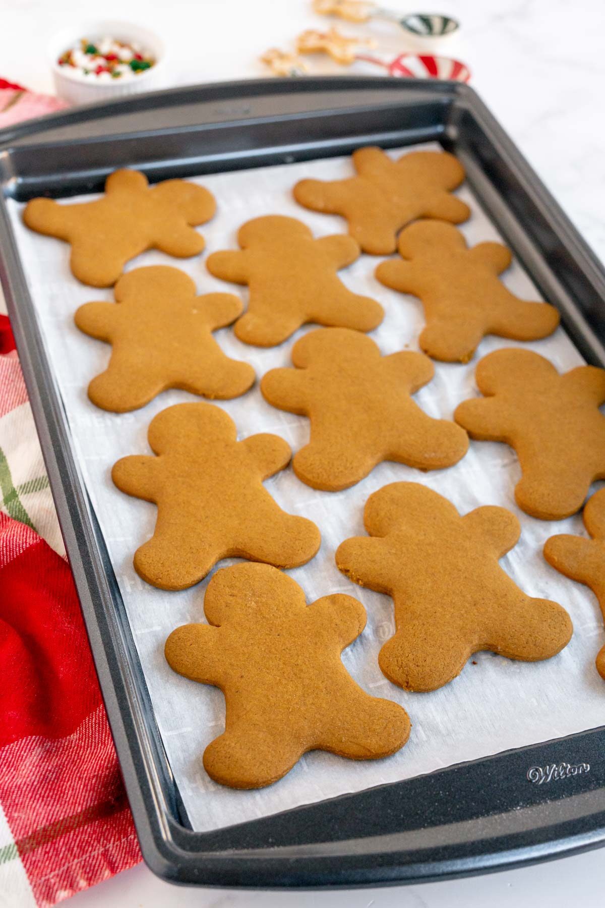 baked gingerbread men on a cookie sheet