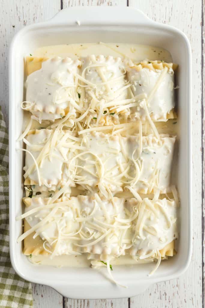 lasagna rolls in a white baking dish