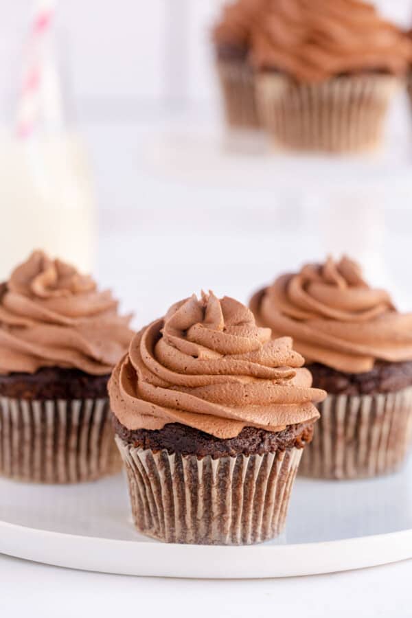 3 chocolate cupcakes with frosting