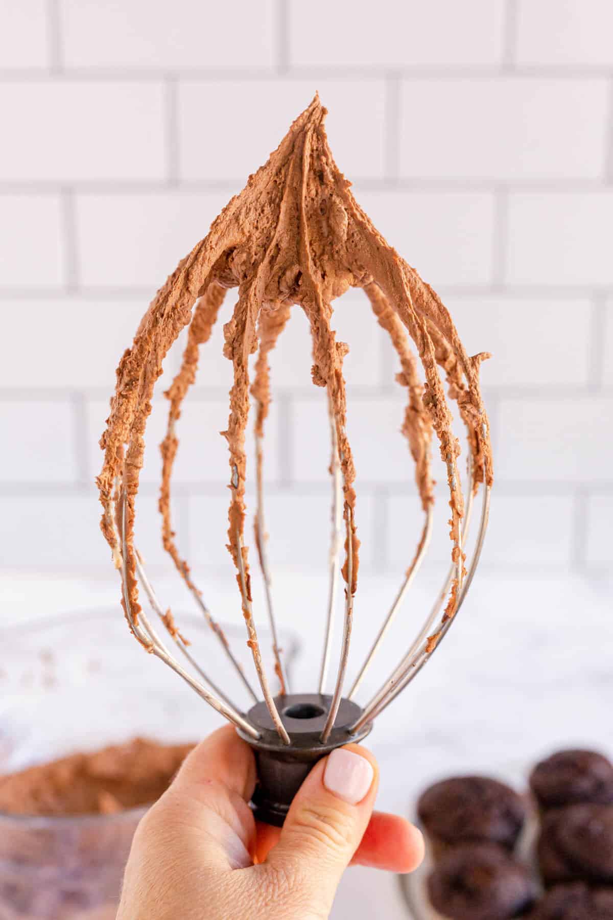 chocolate frosting on a wire whisk