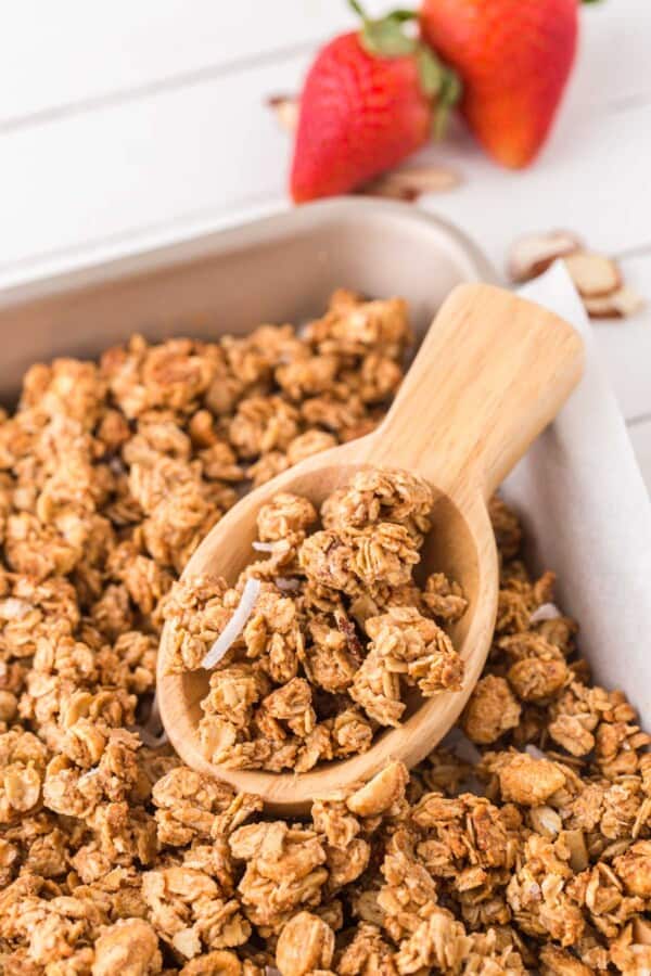 peanut butter granola on a wooden spoon