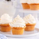 3 vanilla cupcakes with vanilla frosting