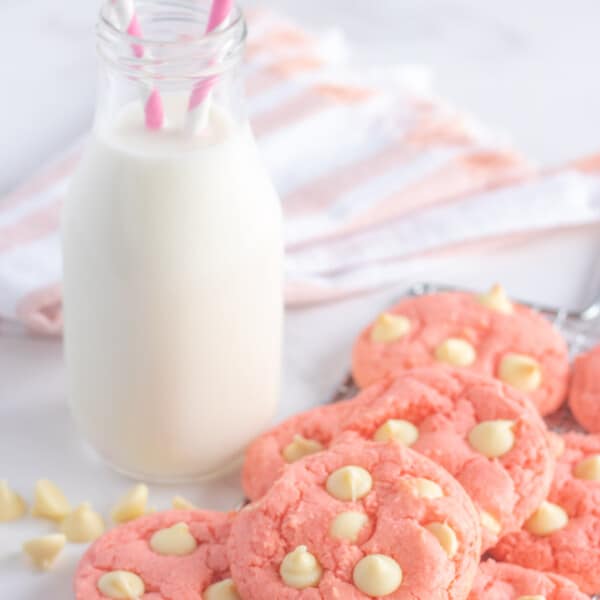 strawberry cake mix cookies with a bottle of milk