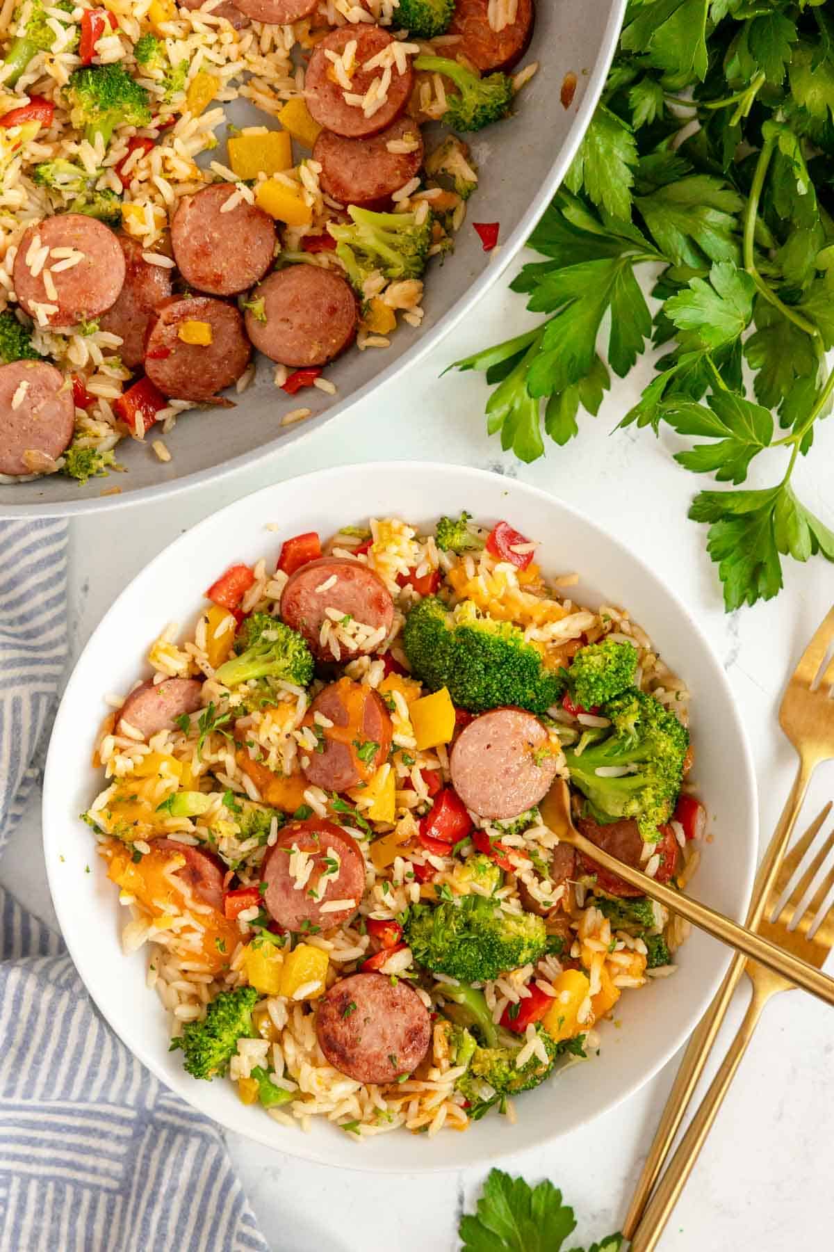 sausage and rice skillet meal in a white bowl.