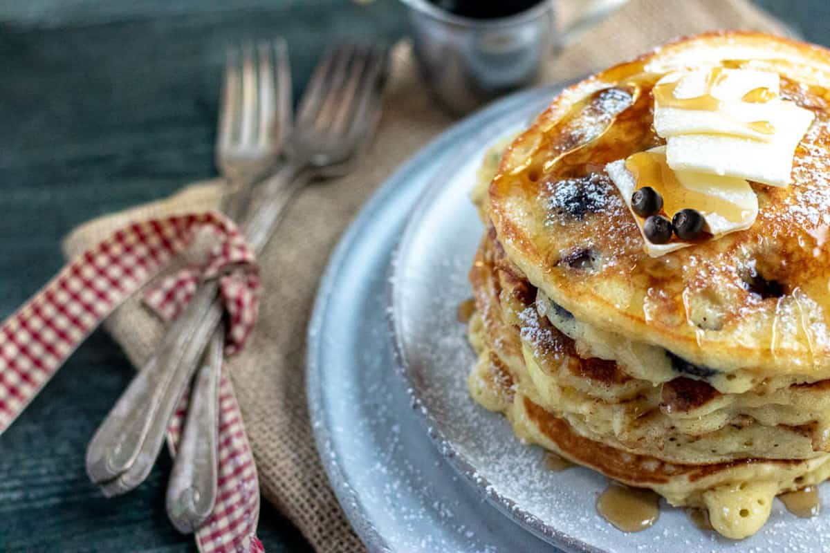 blueberry pancakes on a grey plate
