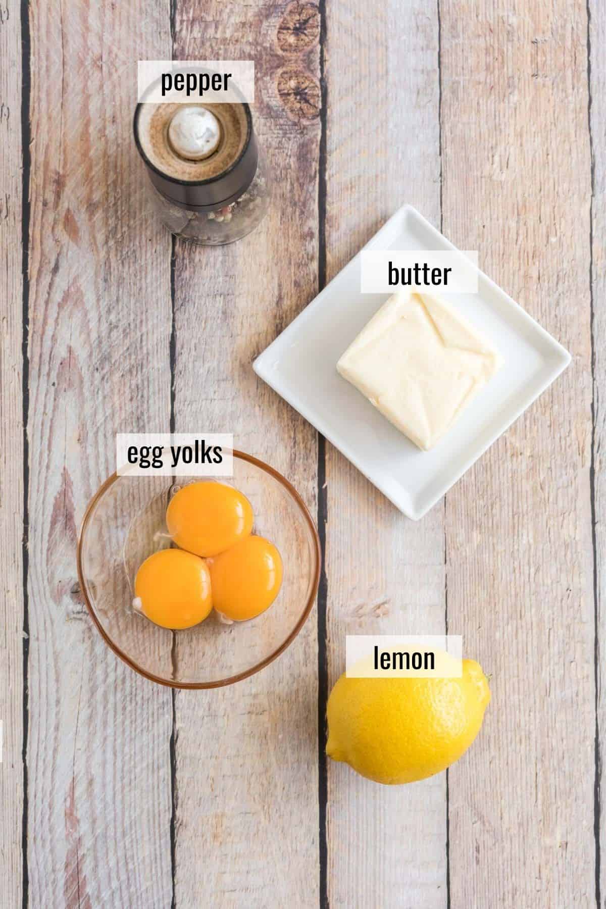 ingredients for hollandaise sauce laid out and labeled