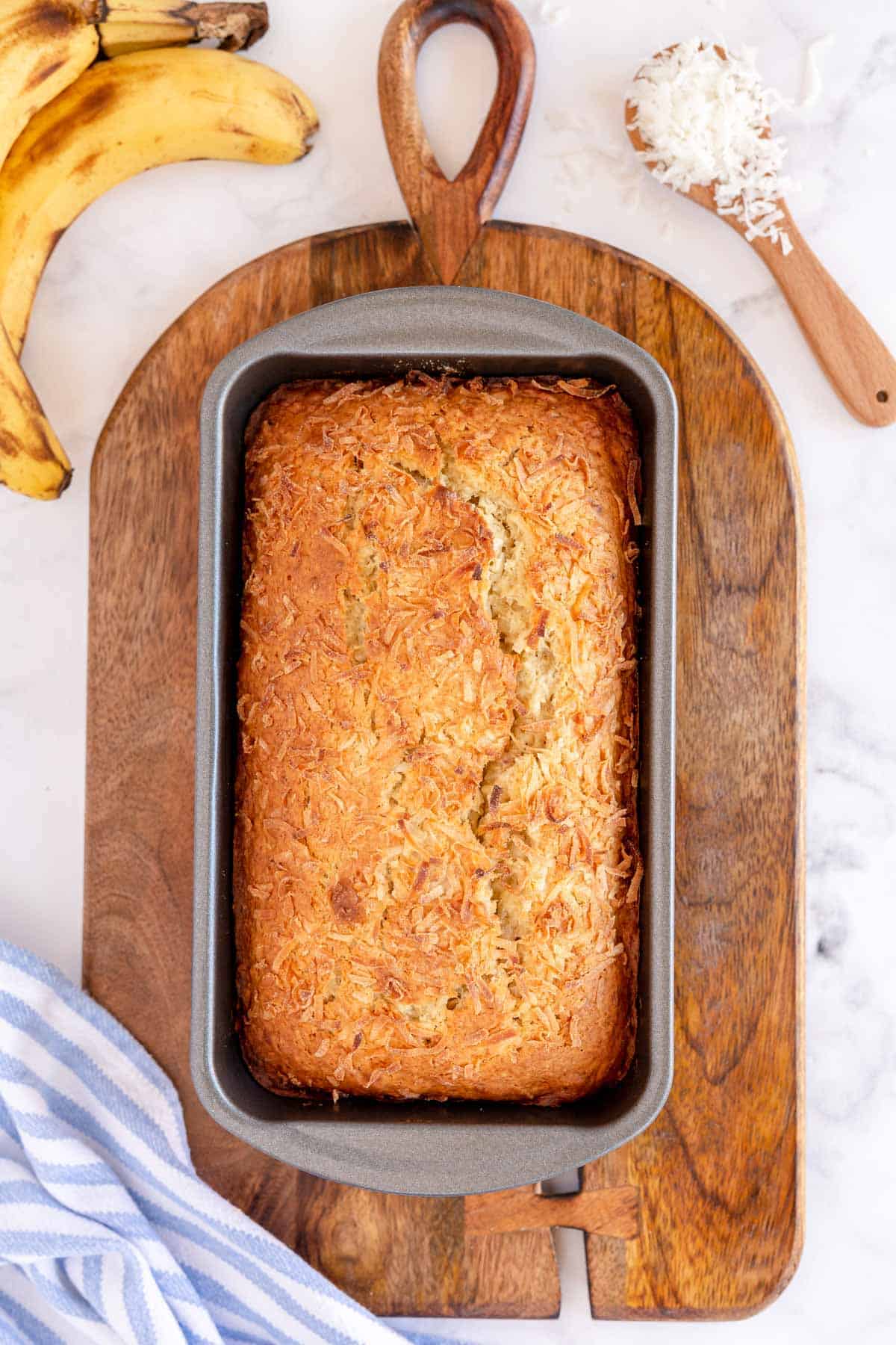 cooked coconut banana bread in a loaf pan