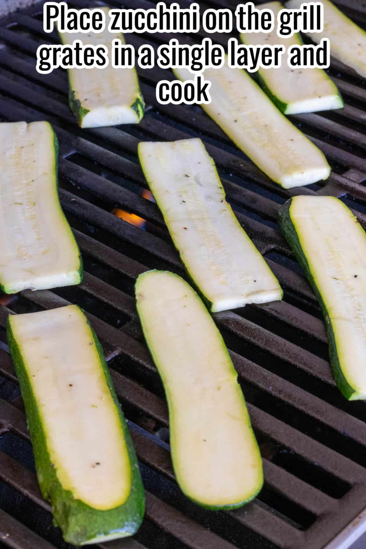 Zucchini slices on a grill.