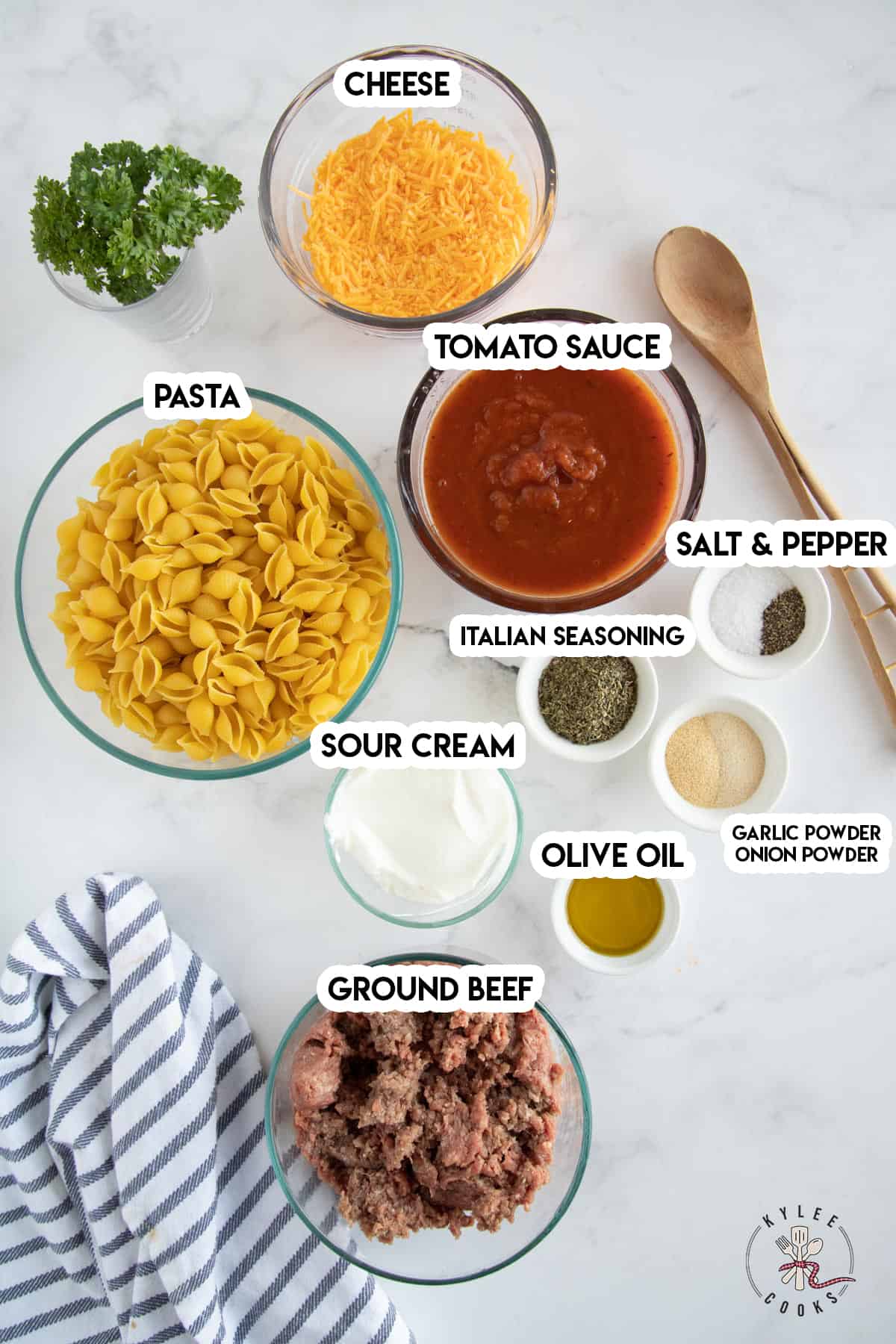 ingredients to make hamburger casserole laid out and labeled