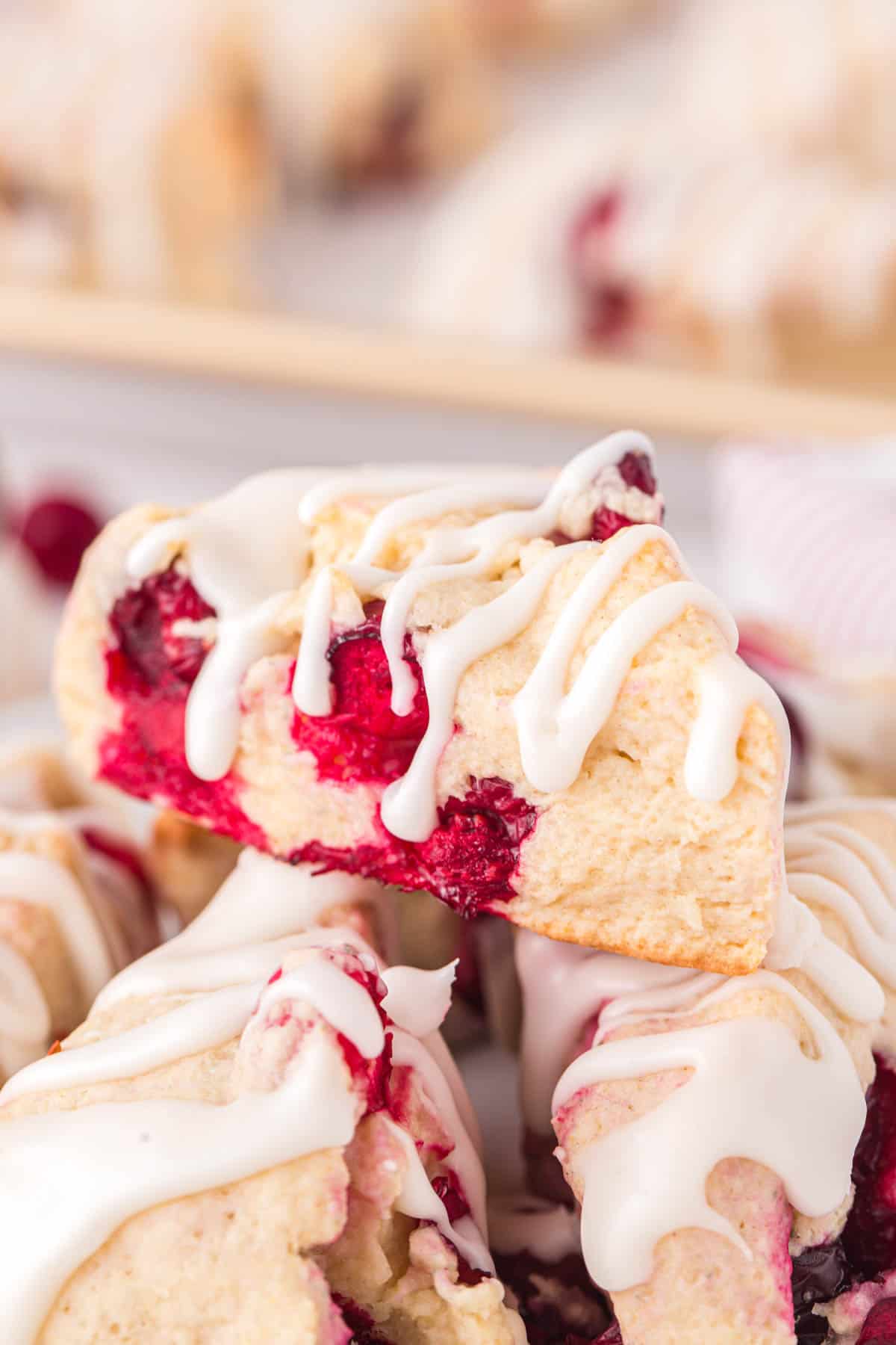 cranberry scones stacked on top of each other.
