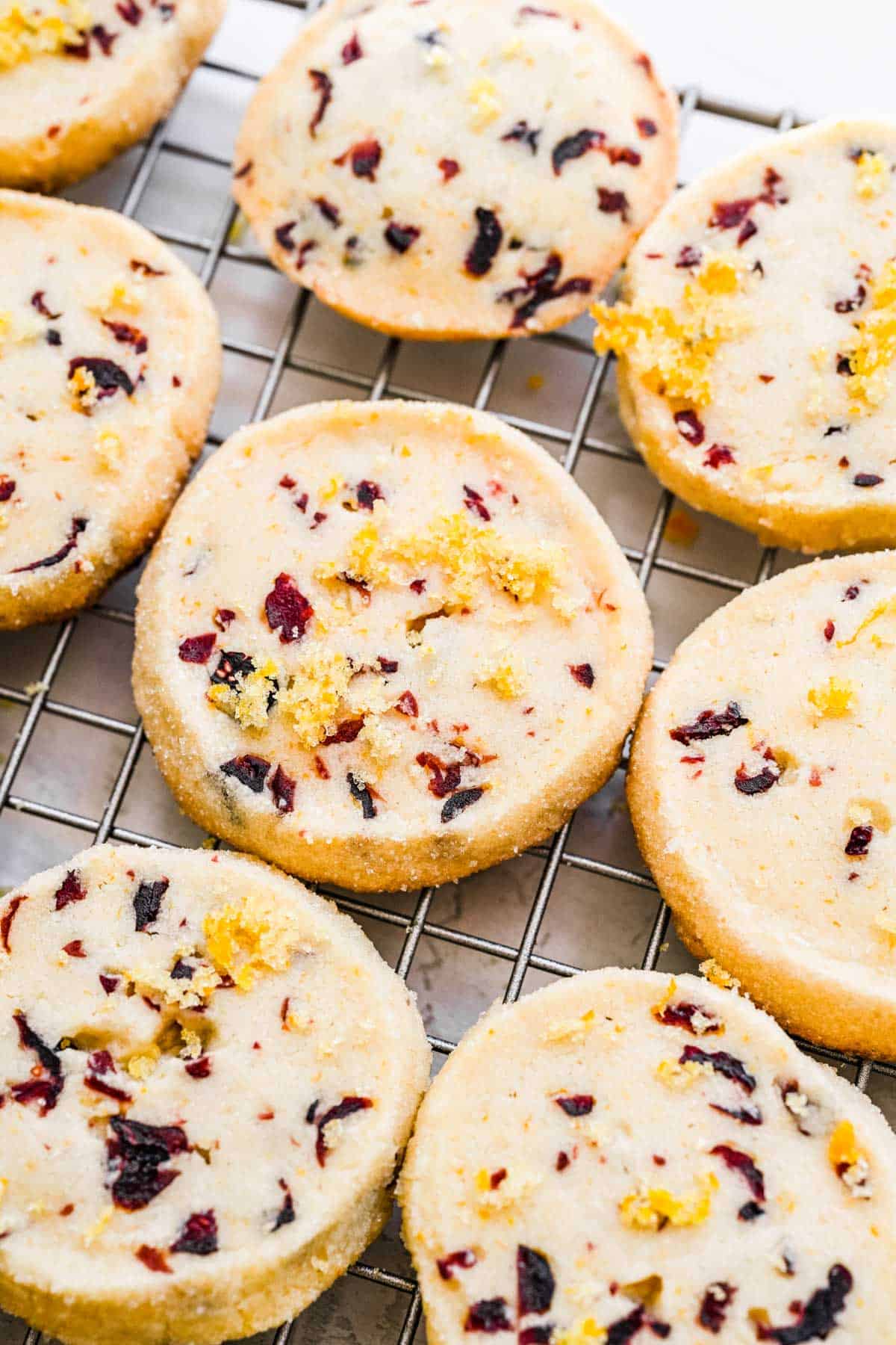 cranberry orange cookies on a cooling rack.