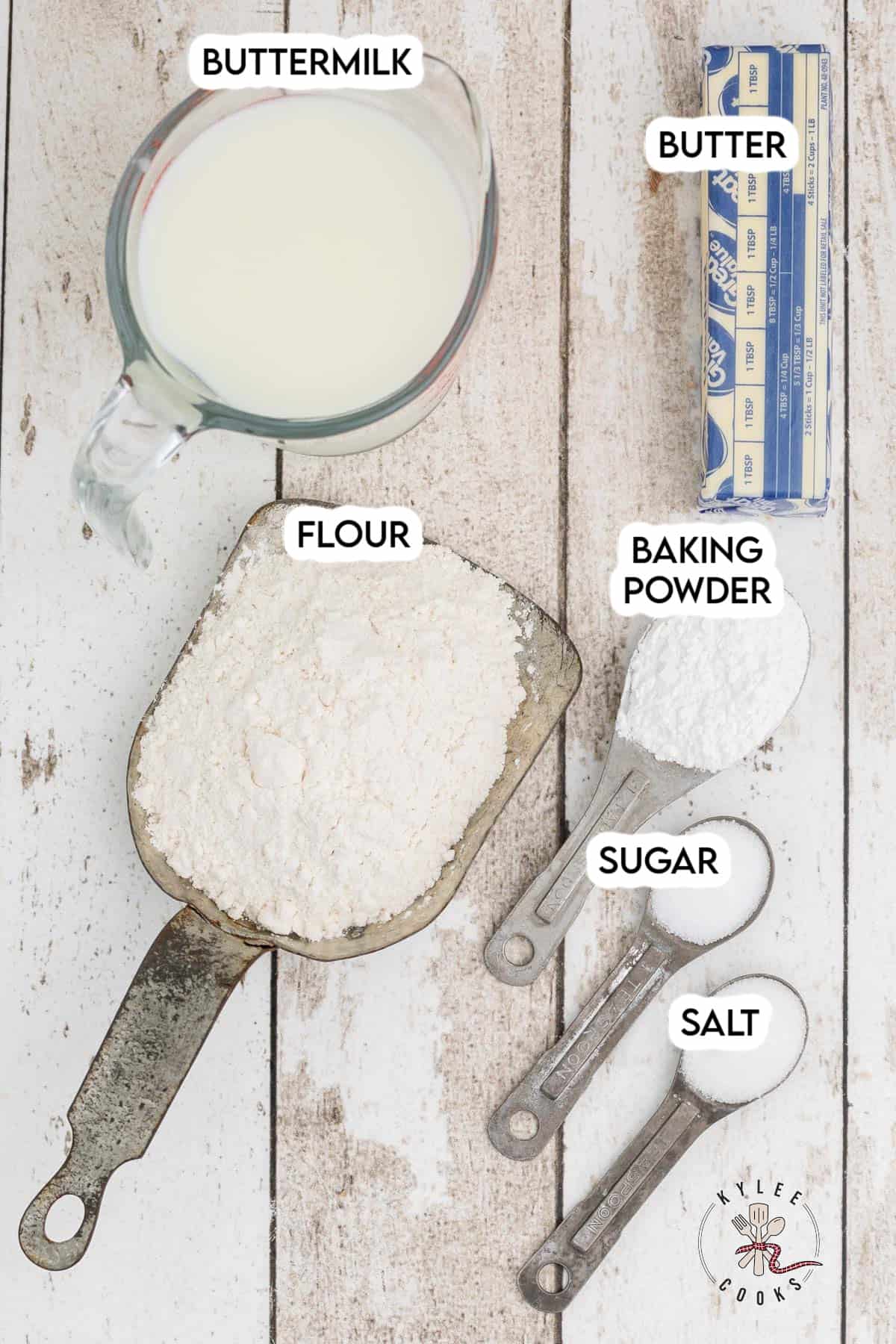 Ingredients to make buttermilk biscuits laid out and labeled.