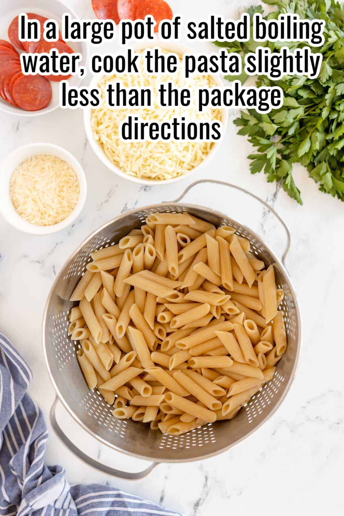 cooked pasta in a large pot with directions overlaid in text.