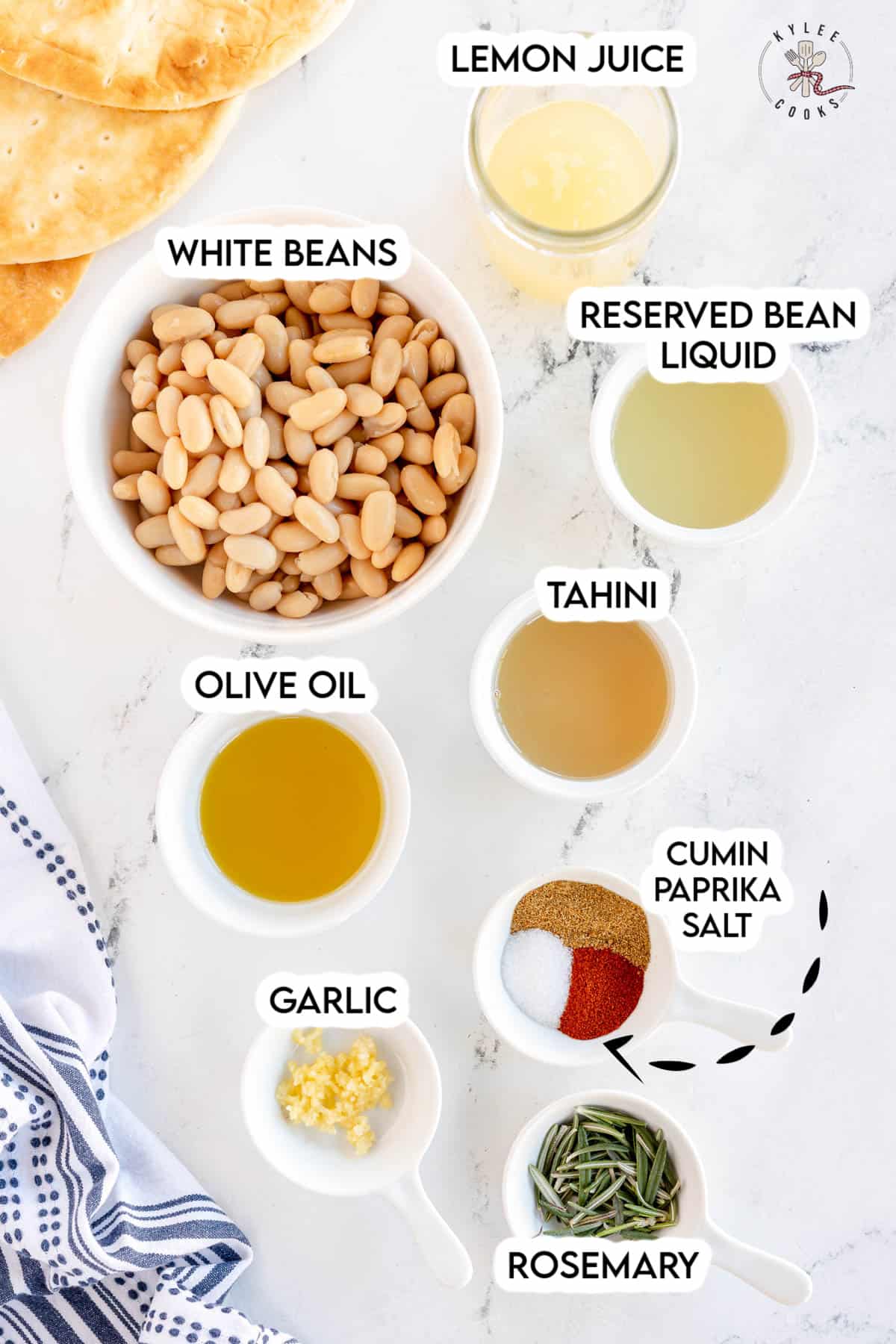 ingredients to make white bean hummus laid out and labeled.