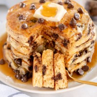 chocolate chip pancakes on a grey plate
