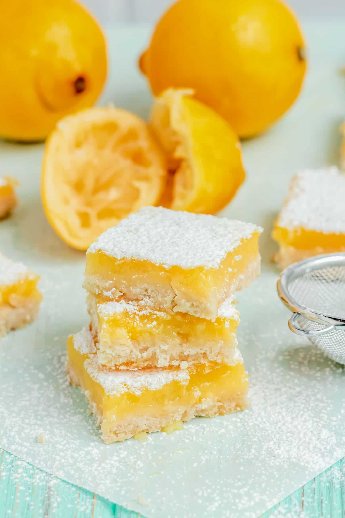 3 lemon bars stacked on top of each other.