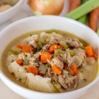 crockpot chicken stew in a white bowl.