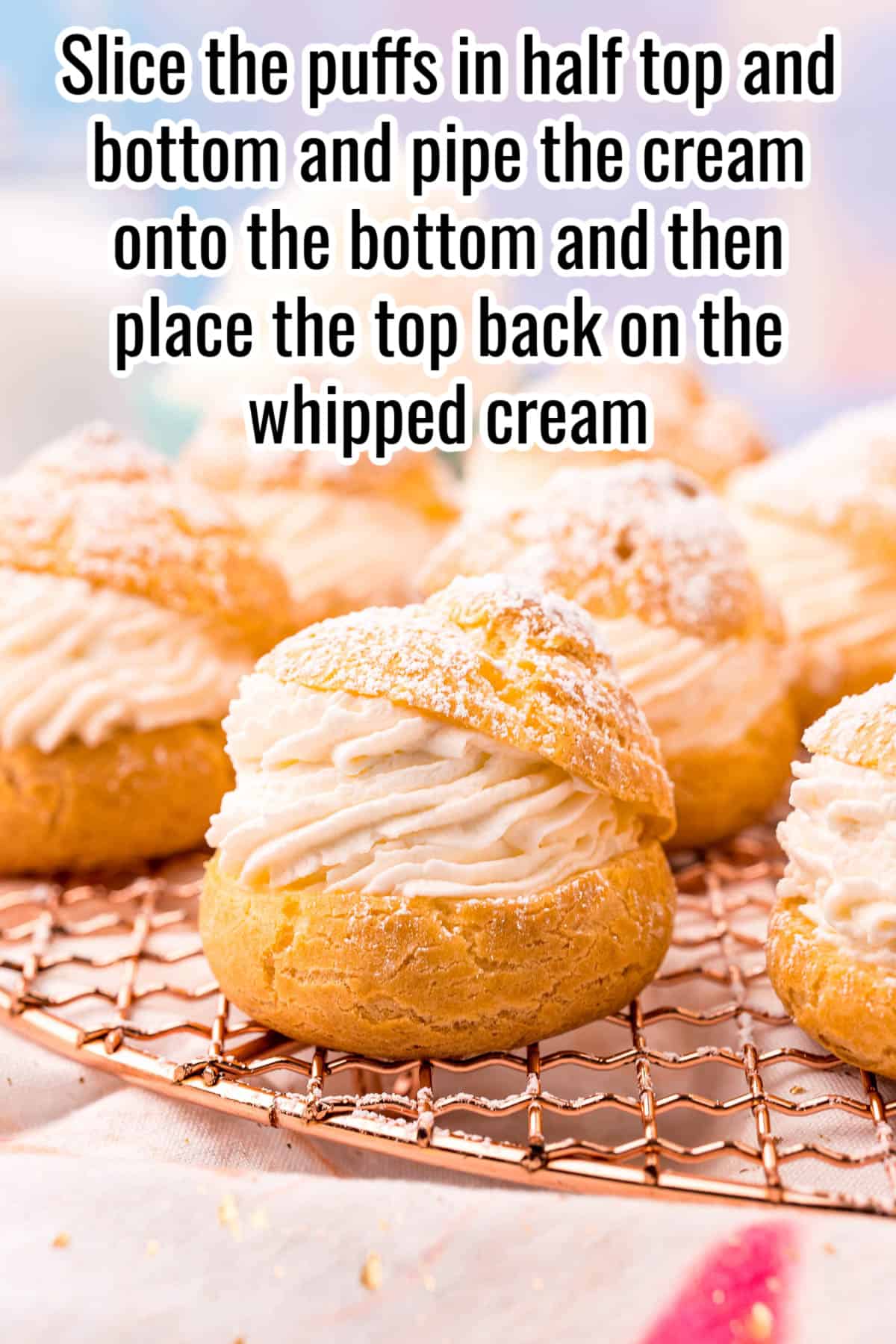 baked cream puff with whipped cream filling on a wire rack.