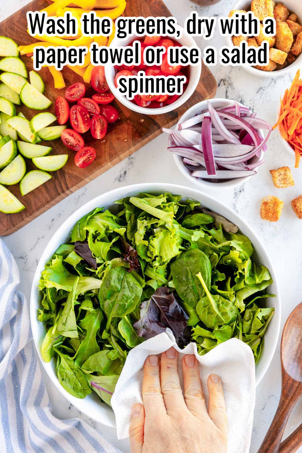 greens in a white bowl with the words "Wash the greens, dry with a paper towel or use a salad spinner overlaid in text.