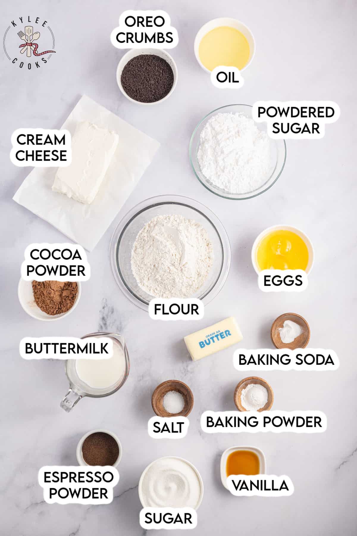 ingredients to make oreo cupcakes laid out and labeled.